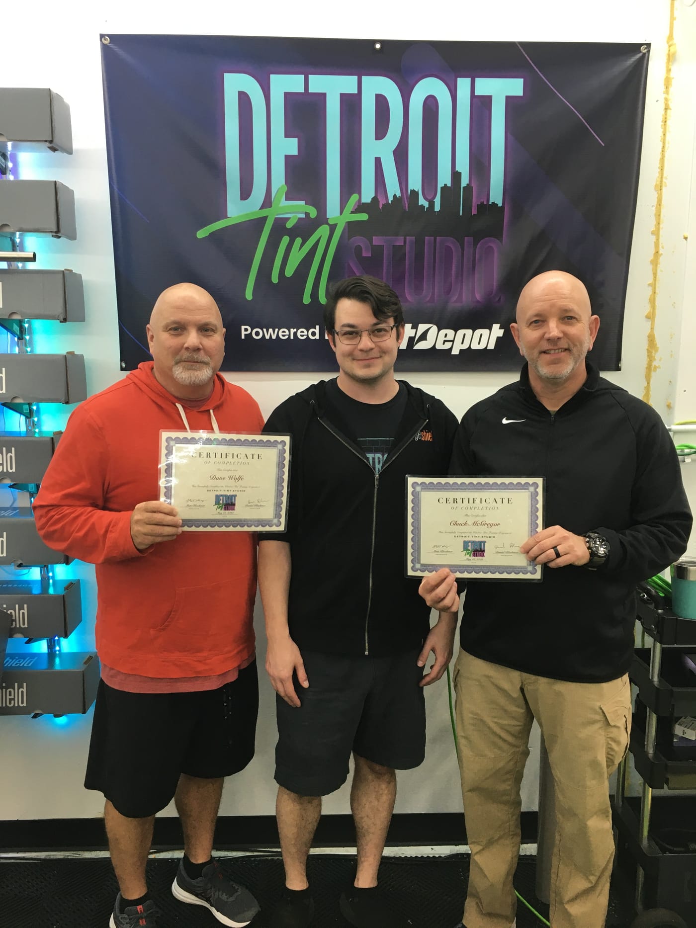 Classic Tint owners with certificates at Detroit Tint Studios training