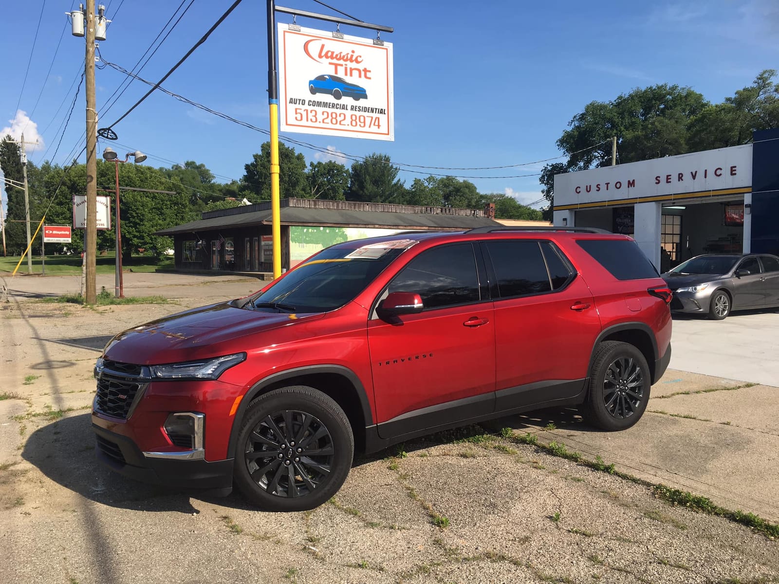 Tinted red Chevy Traverse at the Morrow shop